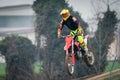 Crema, Italy Ã¢â¬â 12/2022: Motocross bike performing stunts on training track